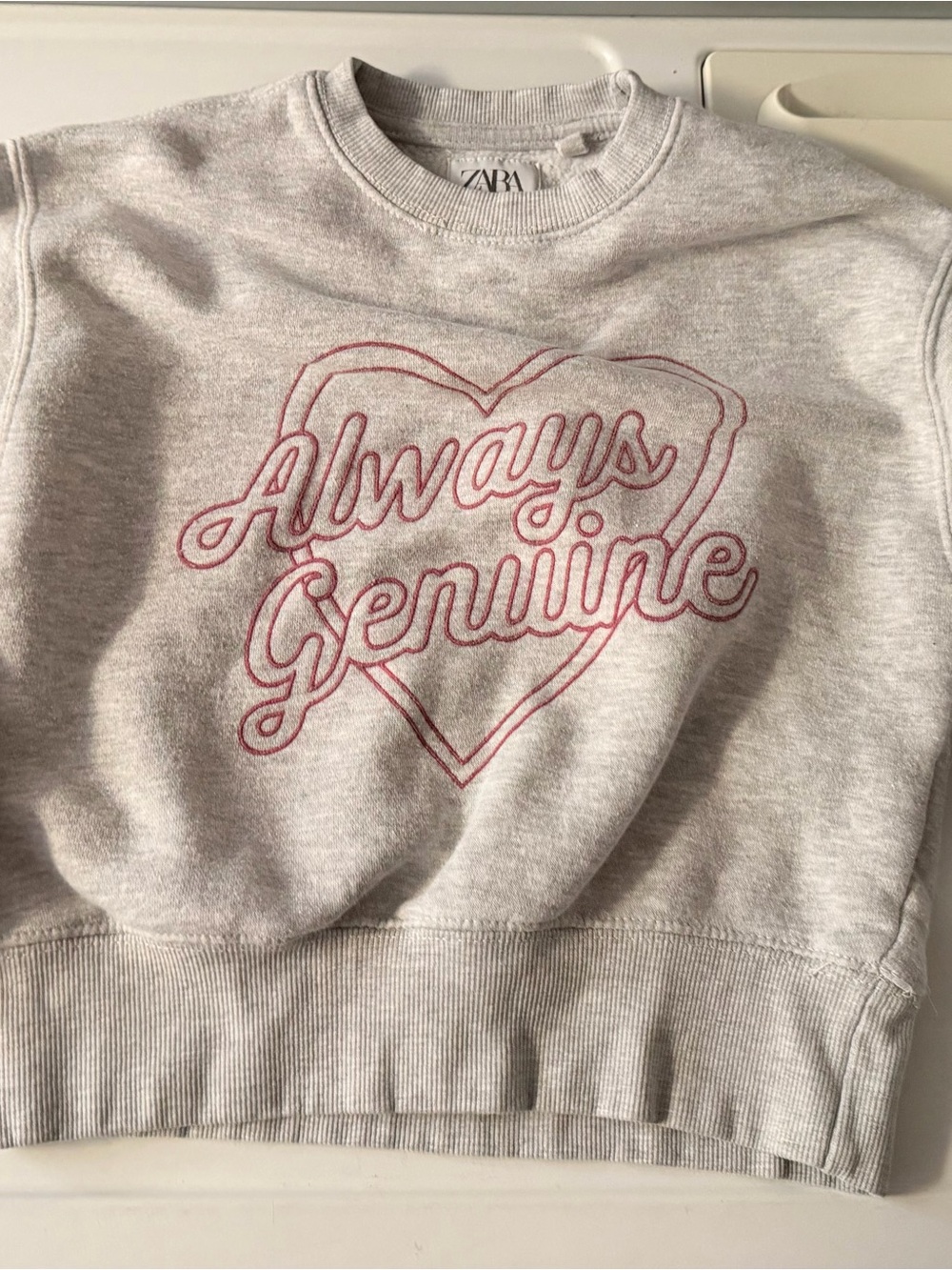 Zara light gray sweatshirt with dark navy logo tag